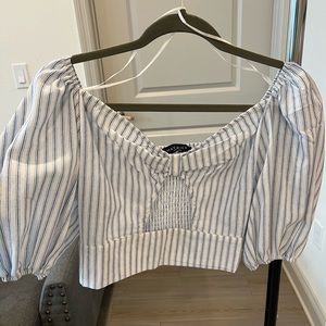 Cut out in the front.  Perfect for spring summer. Never worn. Elastic back